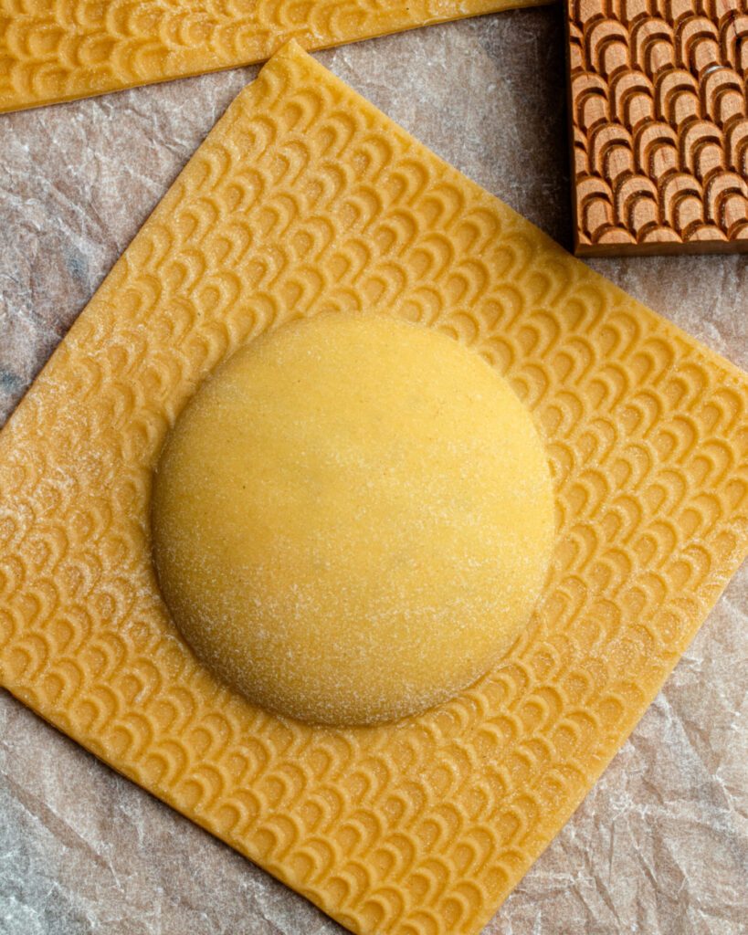 Giant raviolo made with a wooden mold