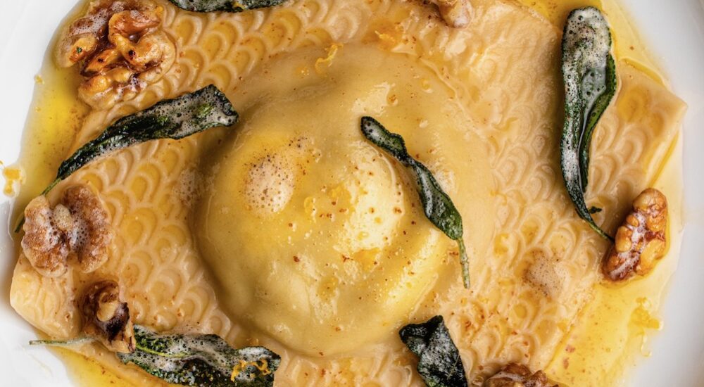 pesto ricotta filled ravioli with brown butter crispy sage and walnuts