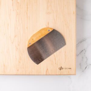 Half Moon Pasta Bench Scraper with wooden handle and metal blade with measurements.