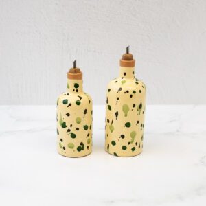 Small and big olive oil cruets in green splatterware pattern